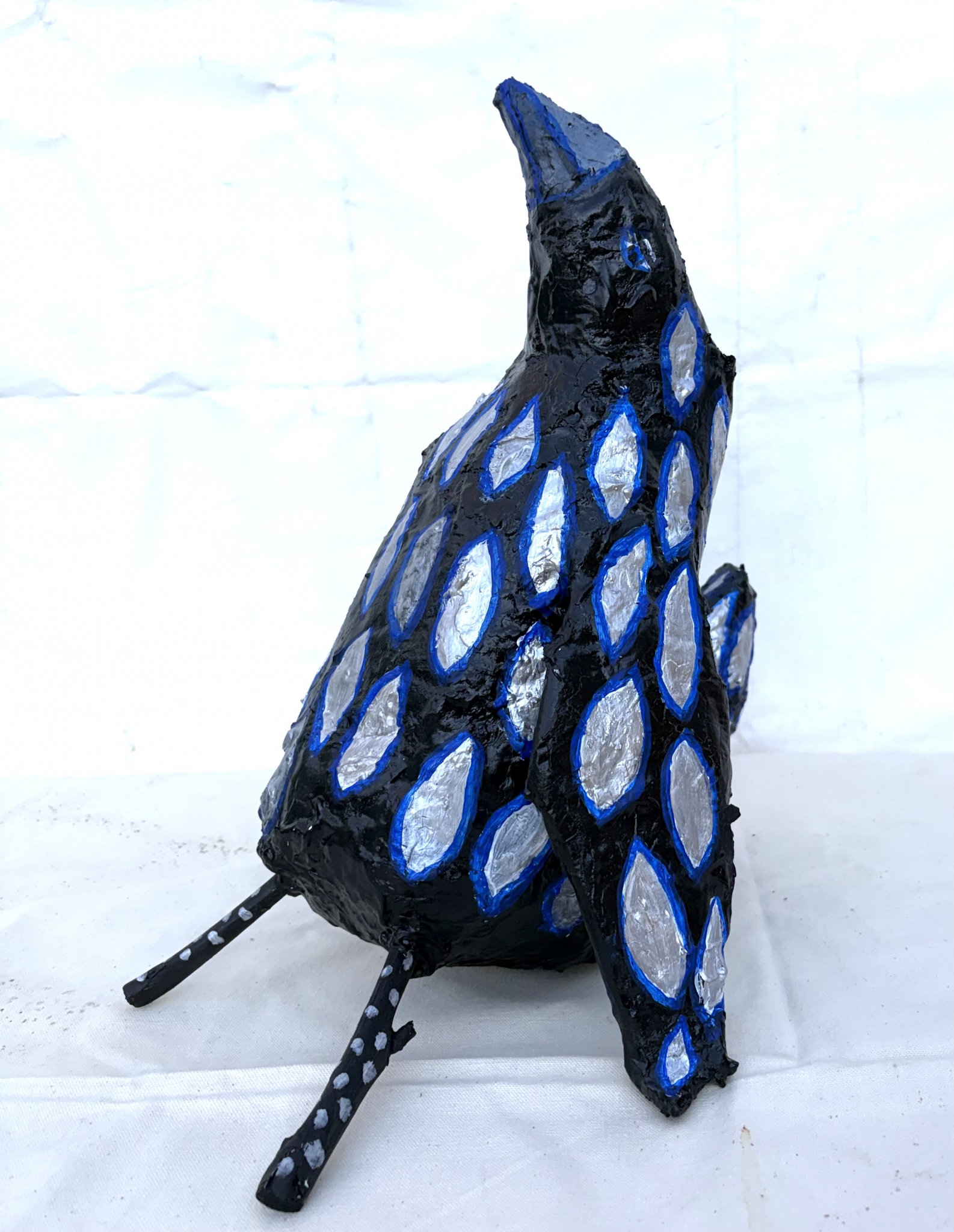 Click here to view Silver feathered raven by Anna Jewel Gove